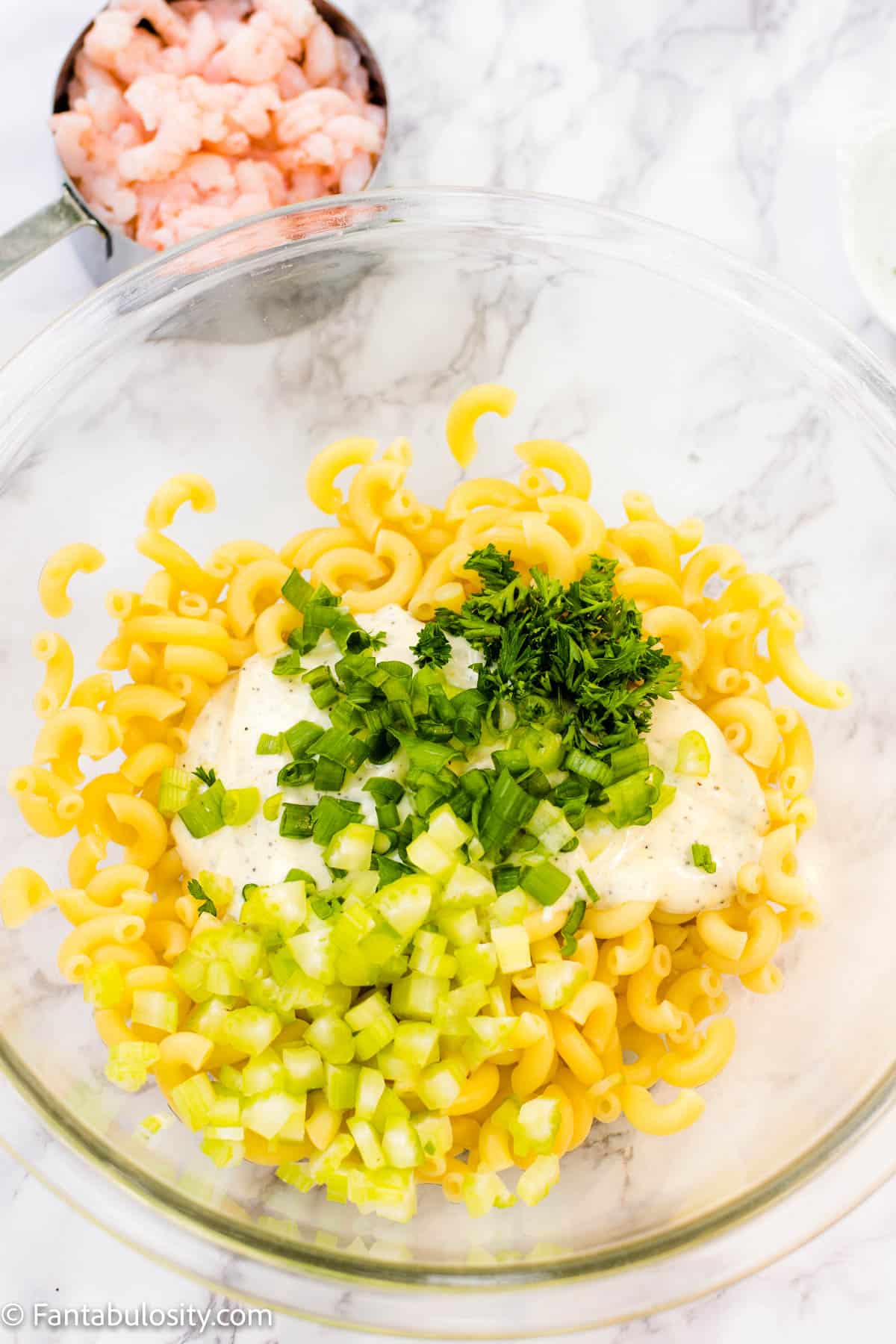 Combine your macaroni, celery, green onions and parsley.