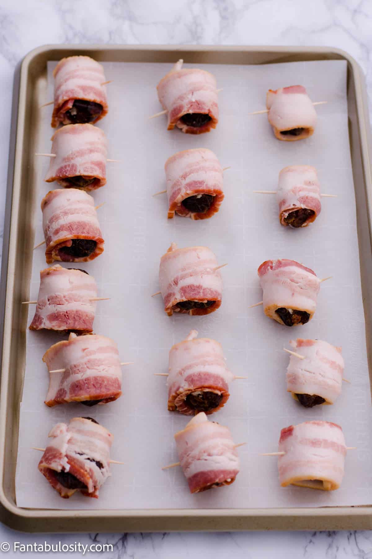Place wrapped dates on parchment lined baking sheet.