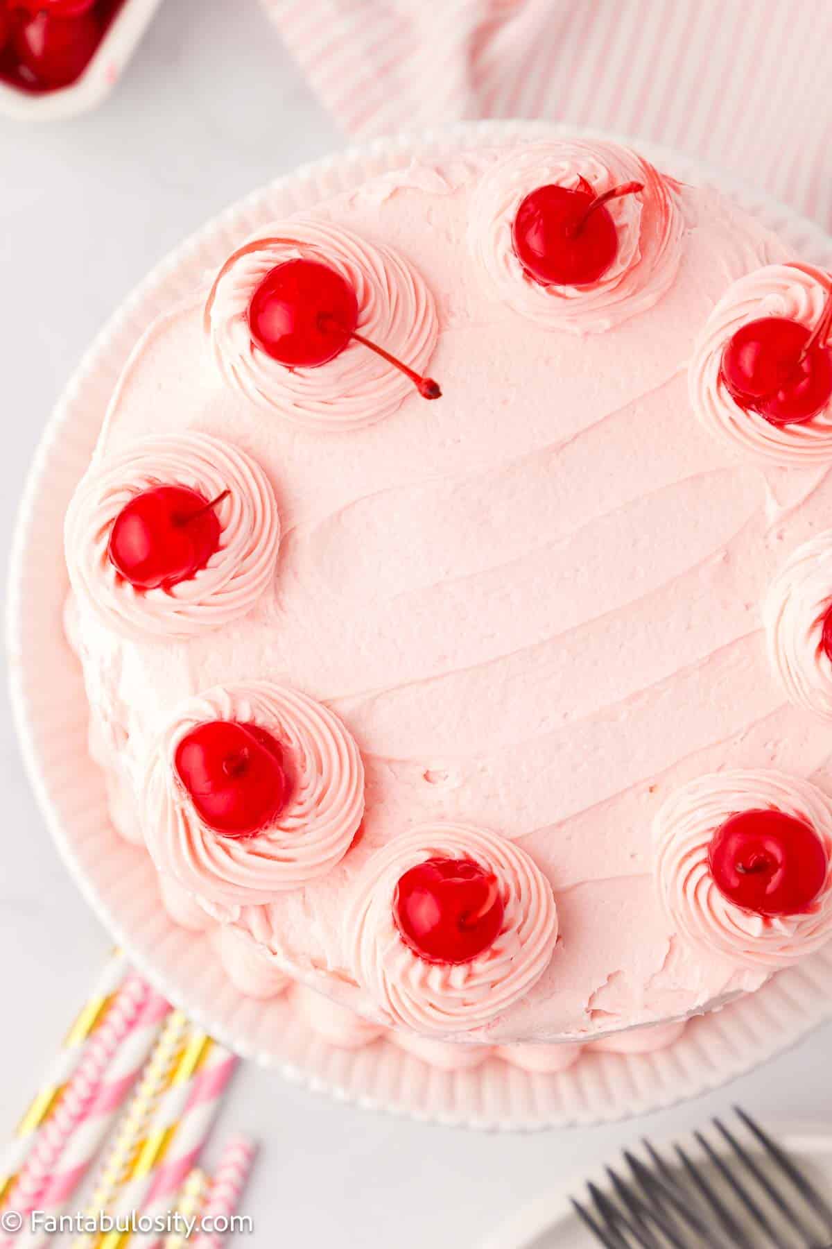Top of cherry chip cake with cherries on top.