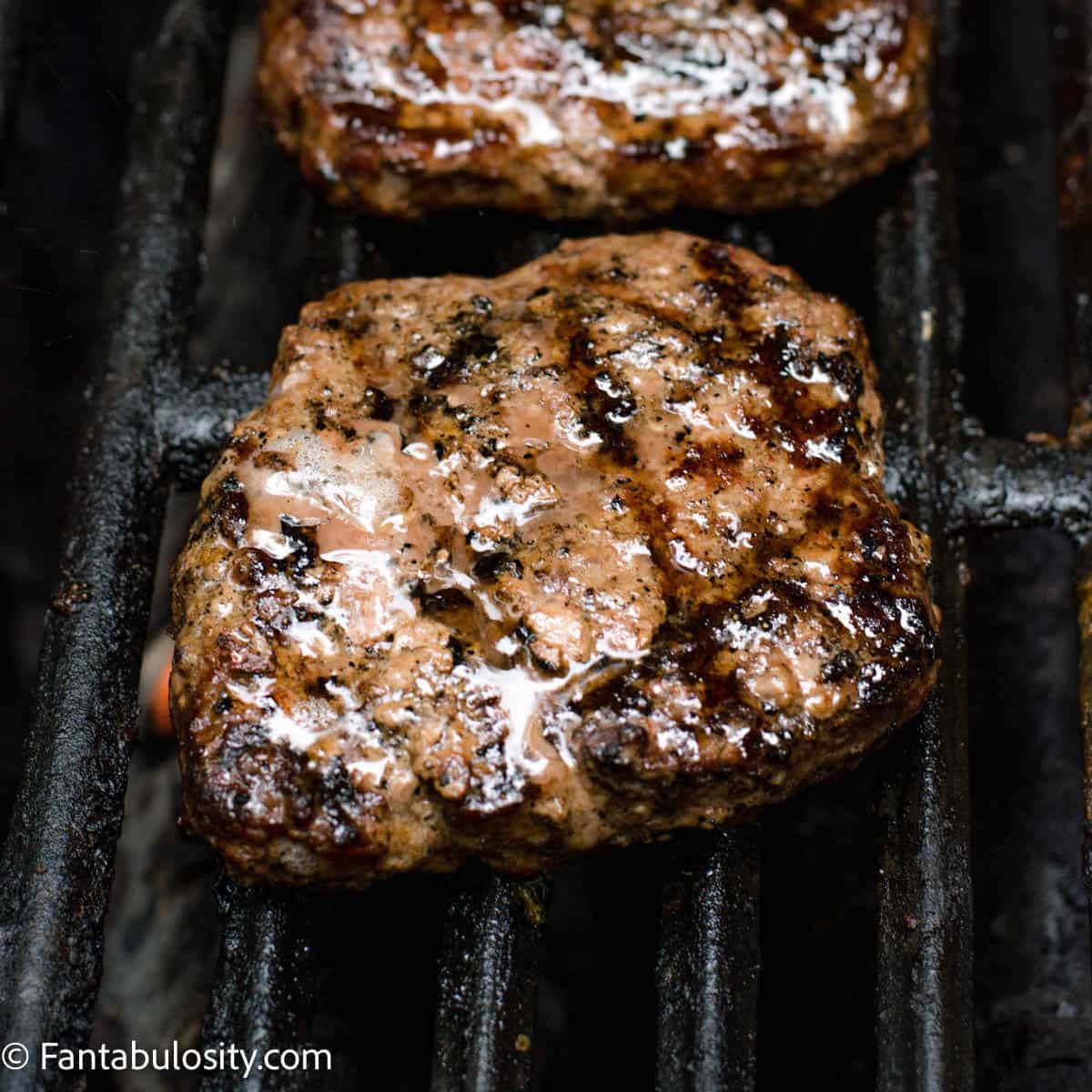 cooked burger patties on the grill