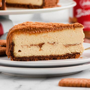Slice of Biscoff Cheesecake on white plates