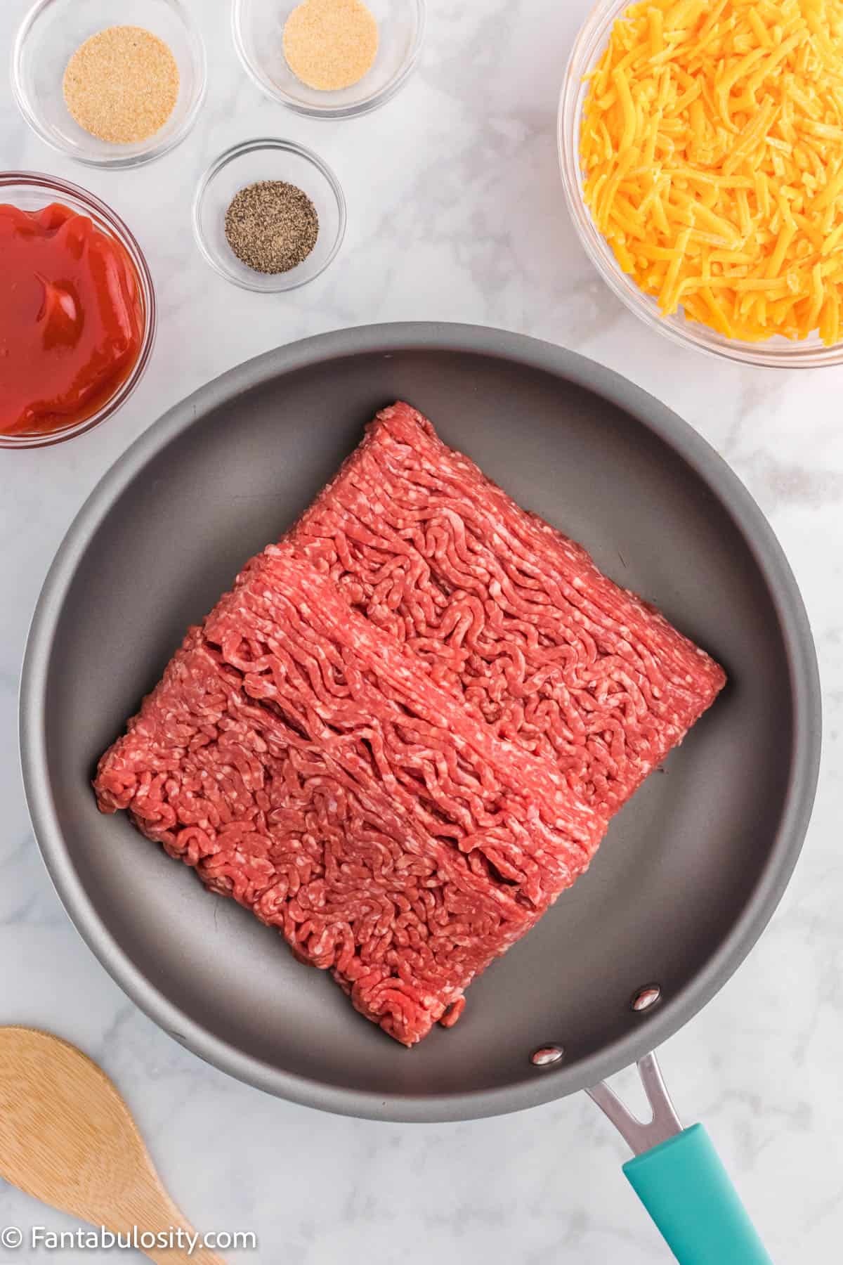 2 lb ground beef in a large nonstick skillet.