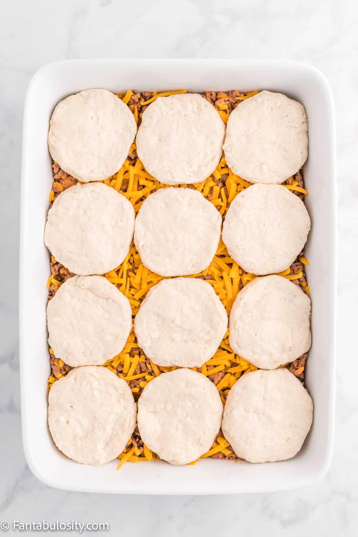12 biscuits (that have been split in half) layered on top of the casserole.