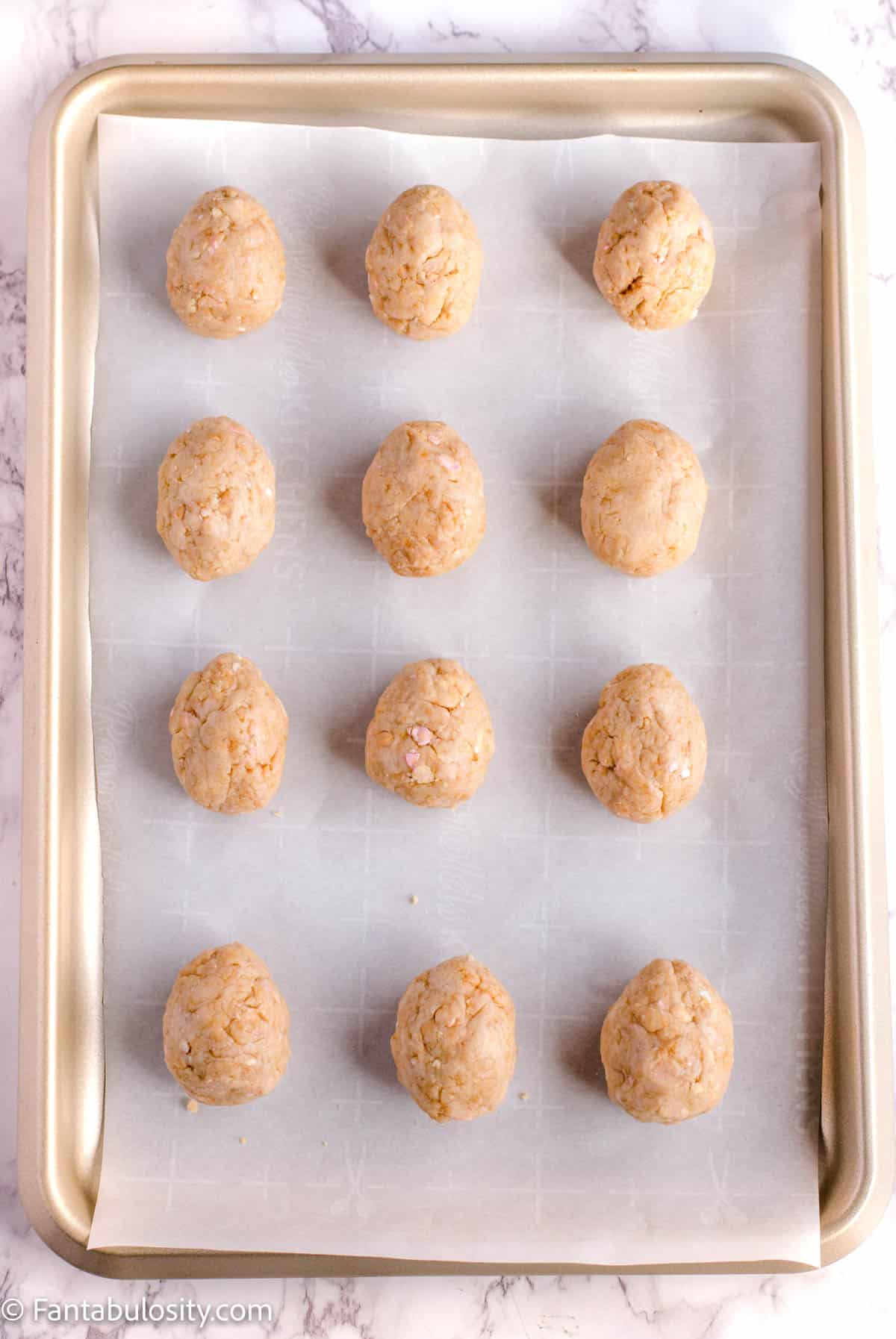 Cookie truffles on baking sheet