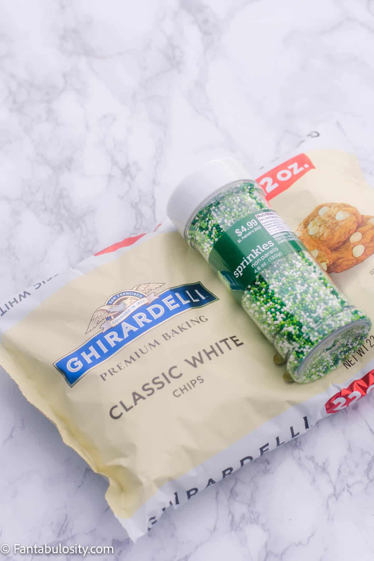 white chocolate chips and green sprinkles on table