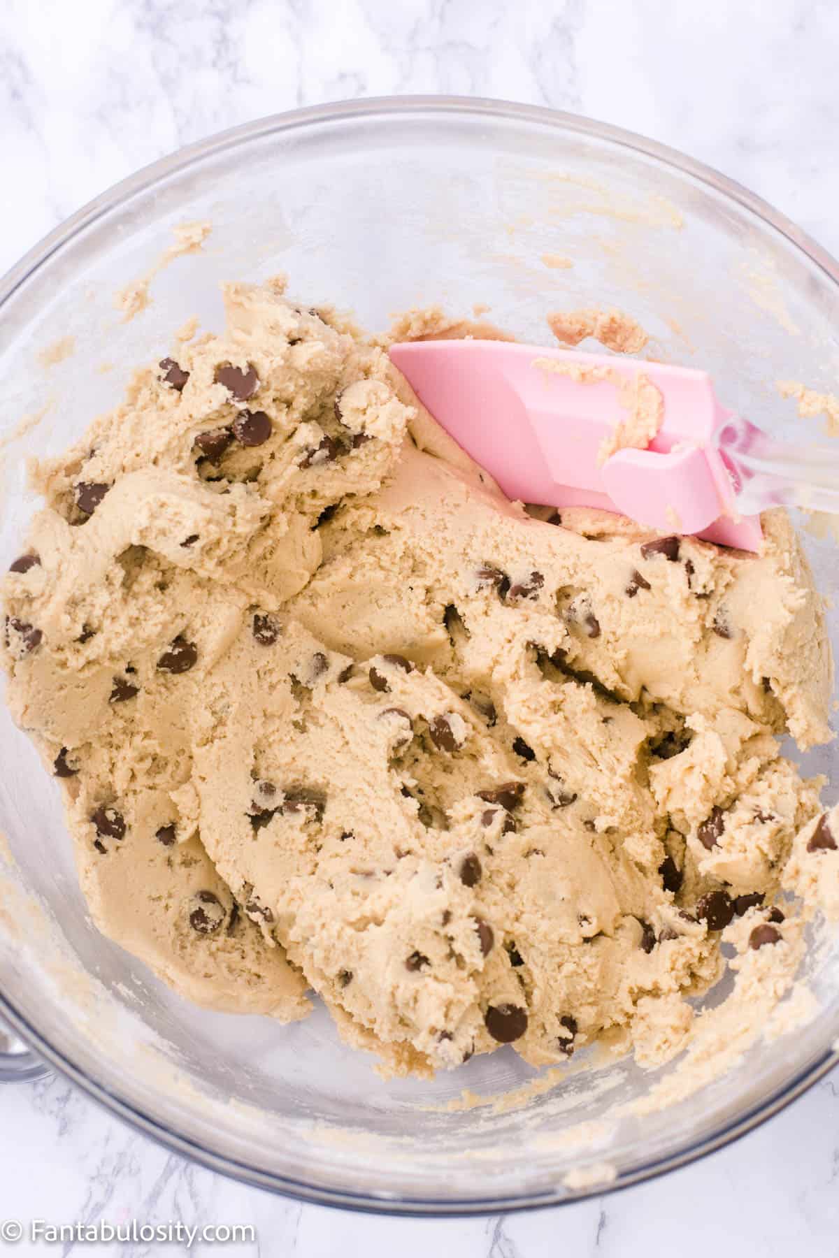 Chocolate chips stirred in to dough