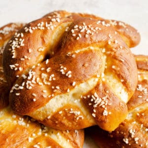 Soft Pretzels stacked on a plate.