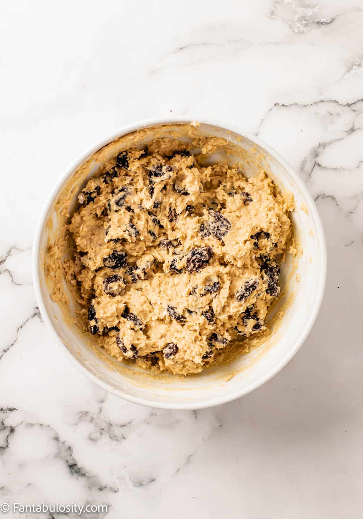 Oatmeal Raisin Cookie batter in a bowl.