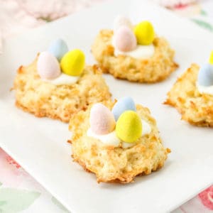 Easter coconut macaroon nest cookies sitting on a plate.