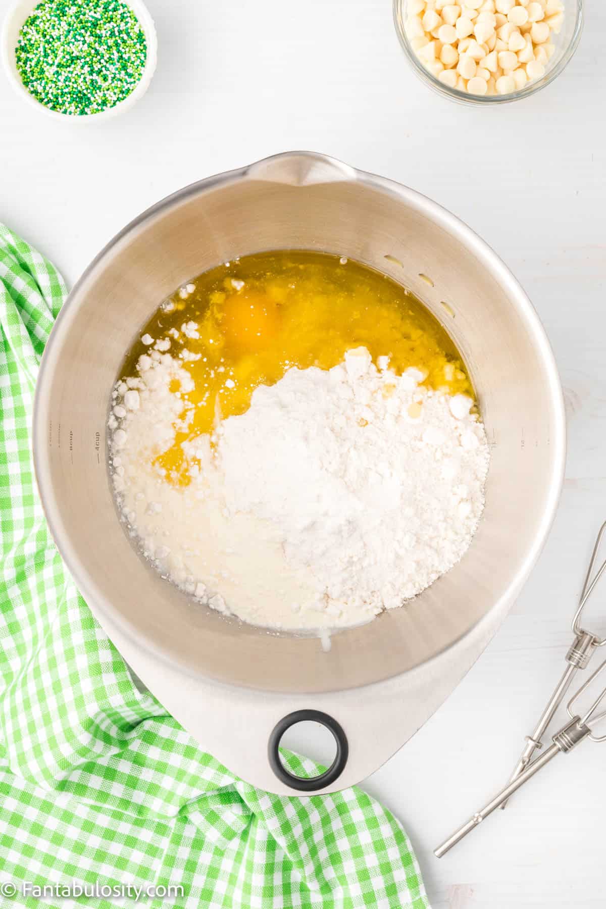 Cake mix, egg, oil, water, whipping cream in a large bowl.