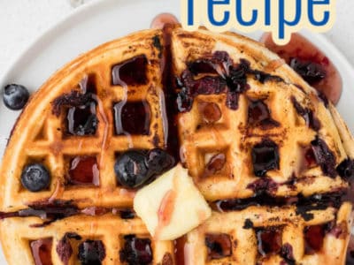 blueberry waffle with butter on top and text on image