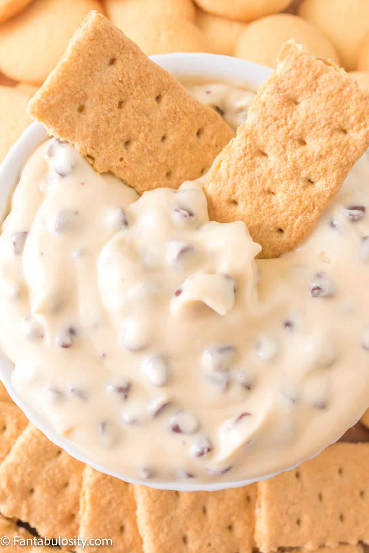 Booty dip in a bowl with graham crackers on top.