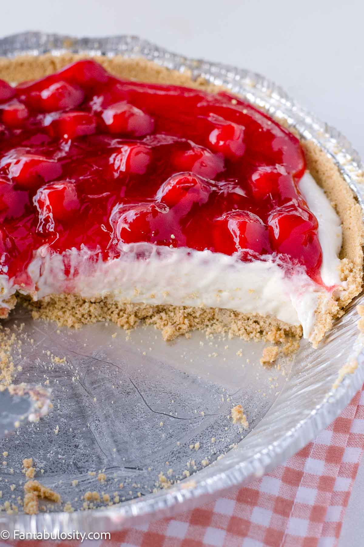 No bake cherry cheesecake in metal pie pan.