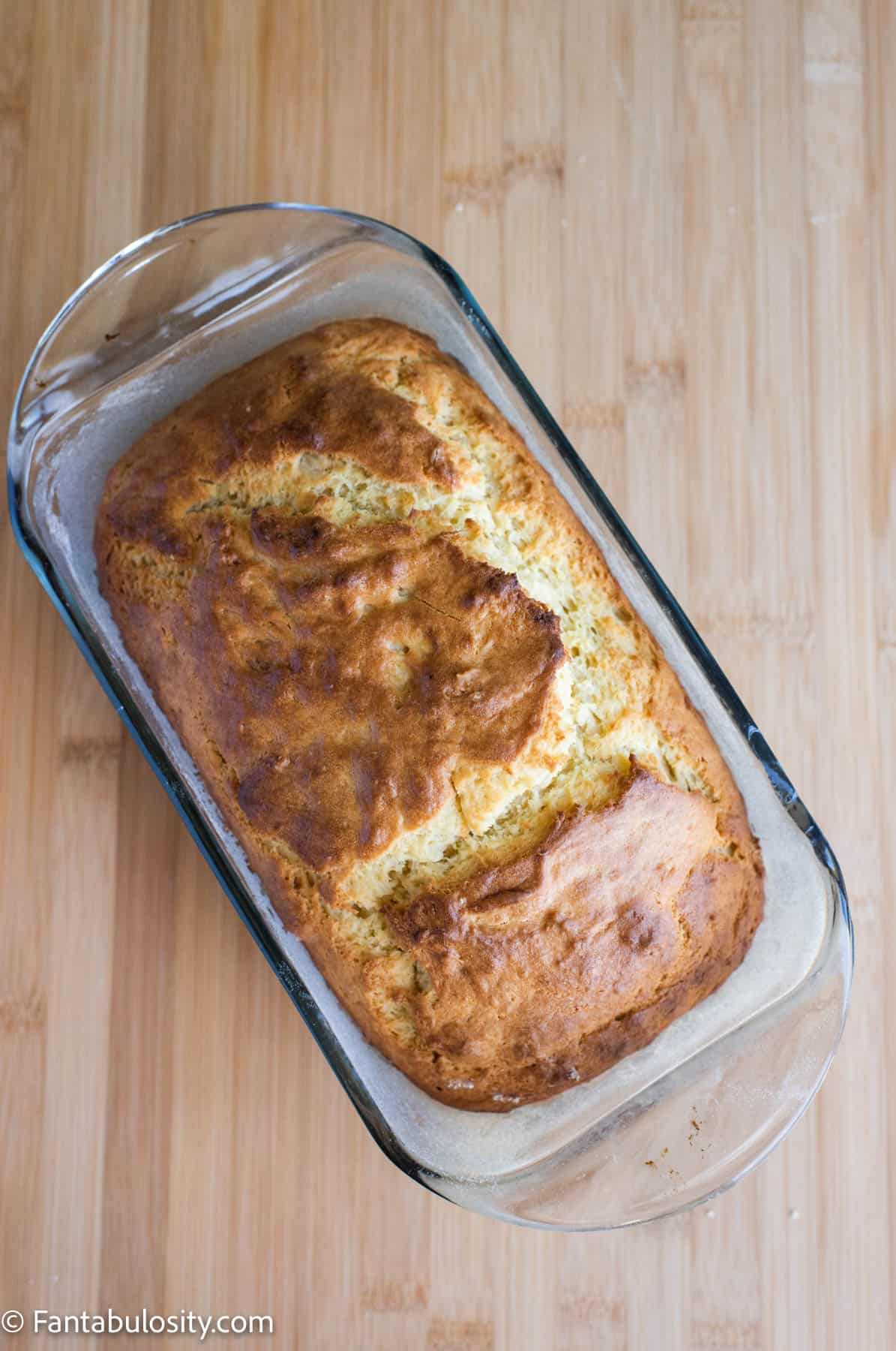Baked pineapple bread in a loaf pan.