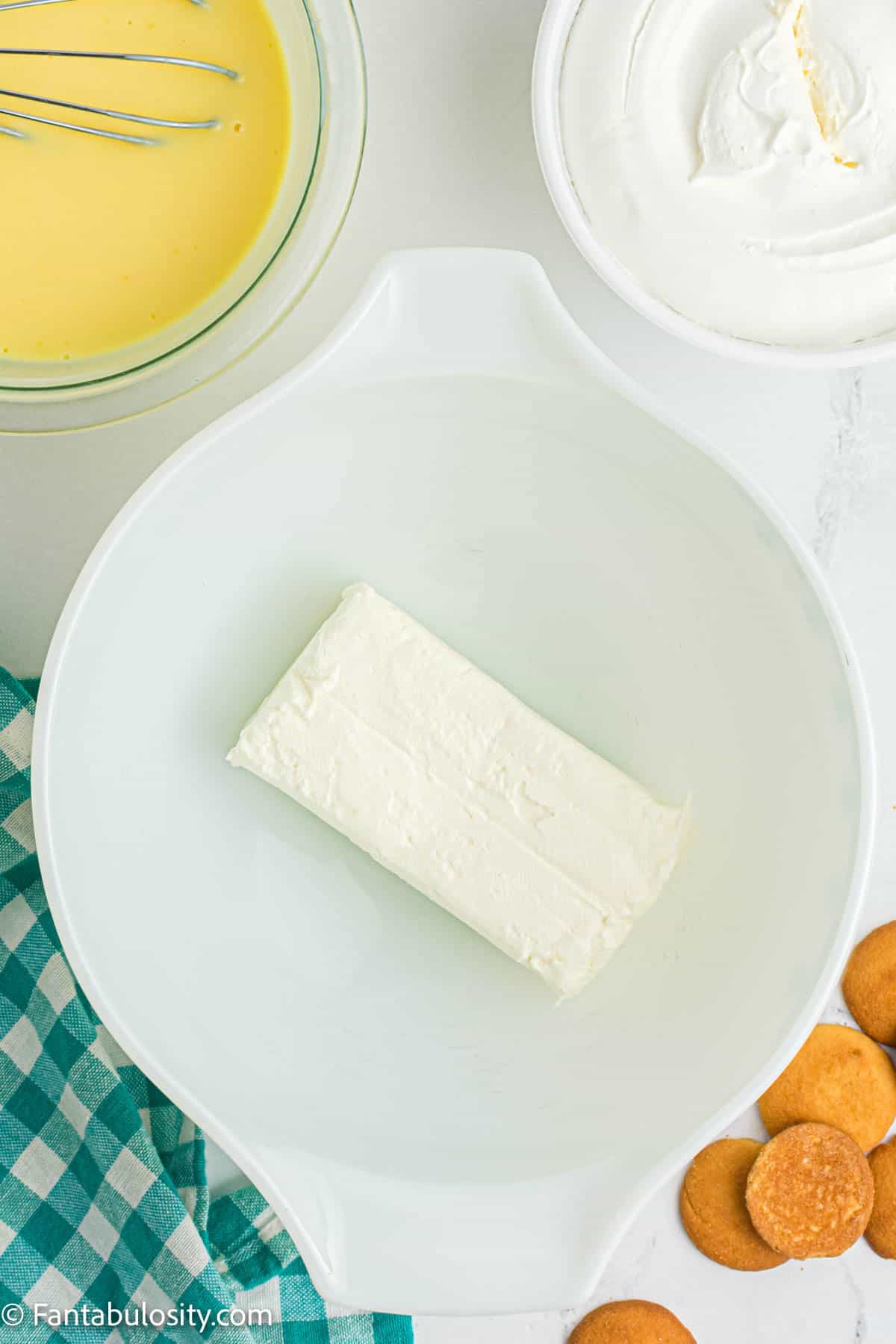 cream cheese in white mixing bowl