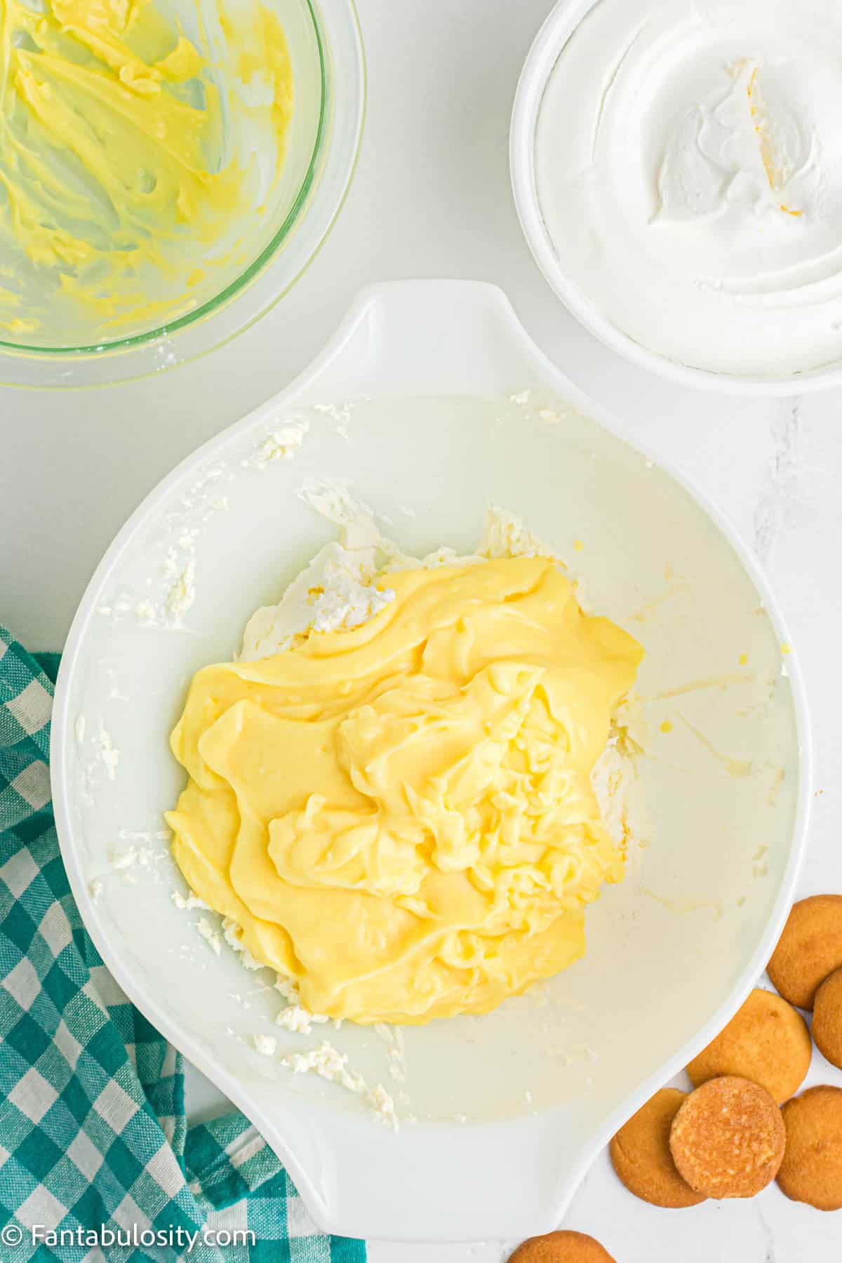 pudding added to cream cheese in mixing bowl
