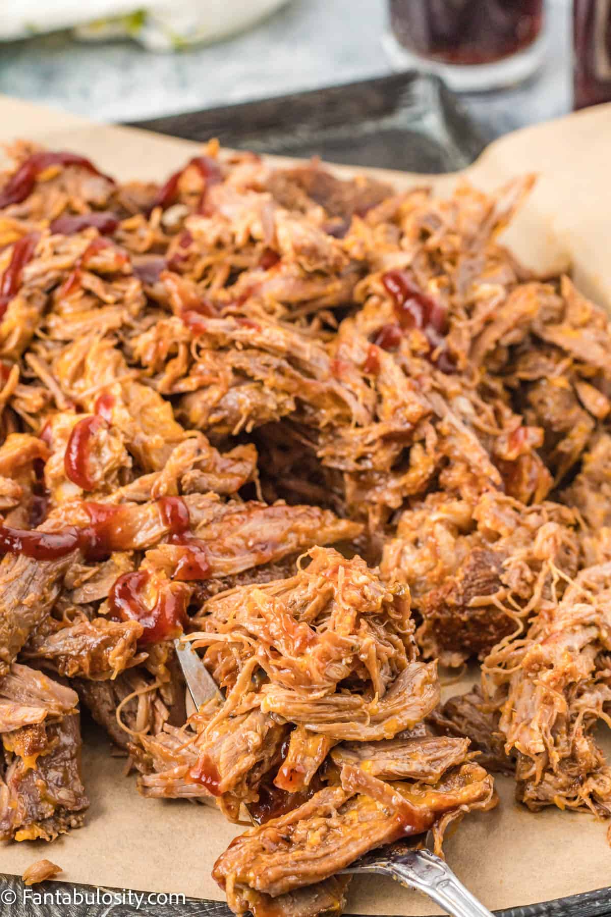 Cherry Cola pulled pork on parchment paper.