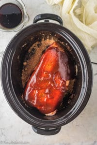 Pork shoulder coated with barbecue sauce