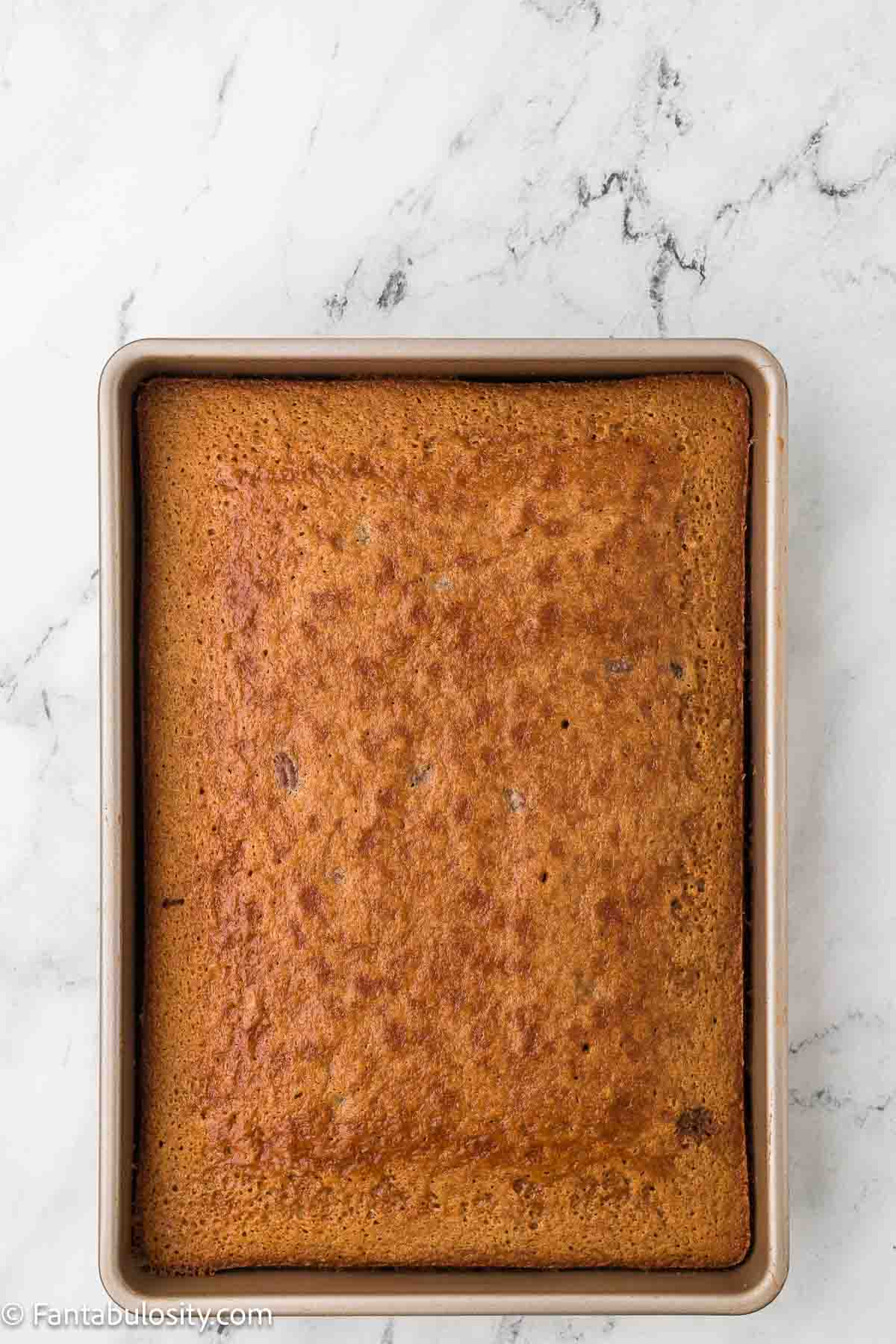 Baked Milky Way cake in a 9x13 baking pan.