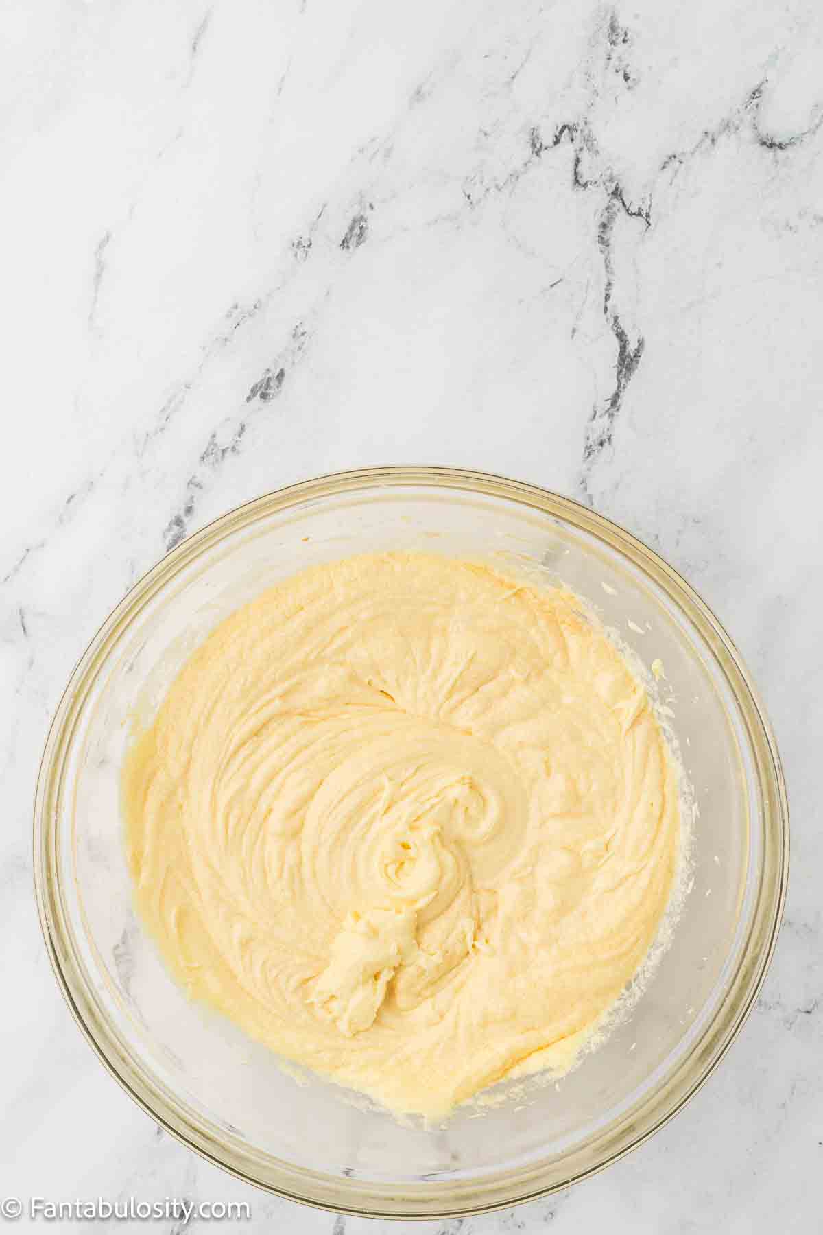 Eggs and vanilla added to flour and butter sugar mixture.