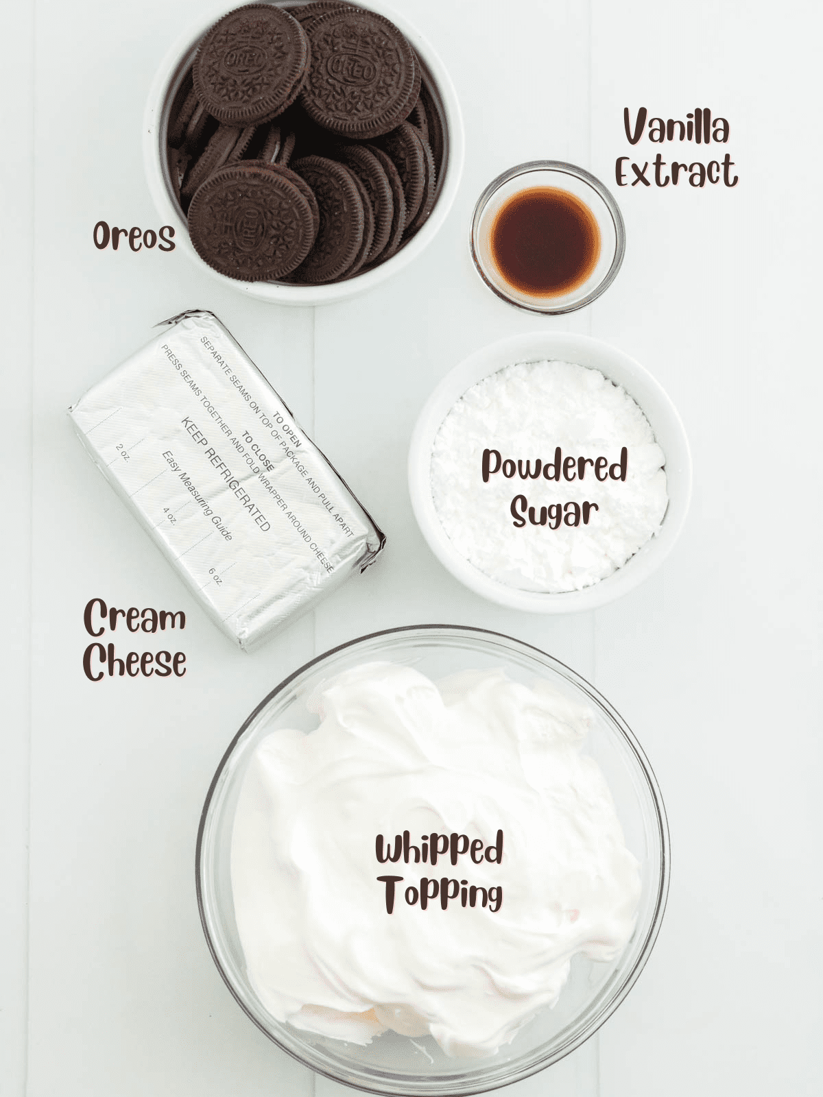 Ingredients for Oreo dip set out on a counter with labels on the image.