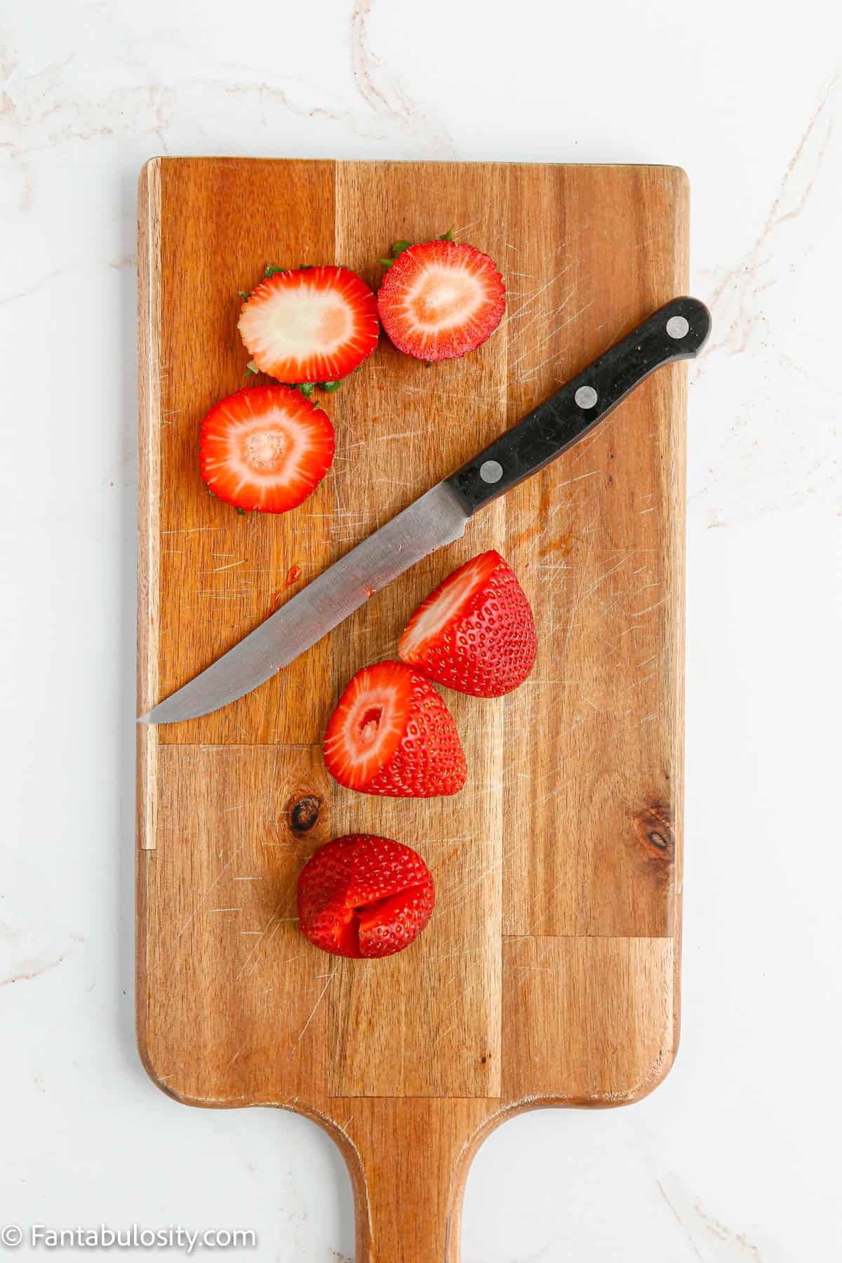 strawberries sliced and cut for filling