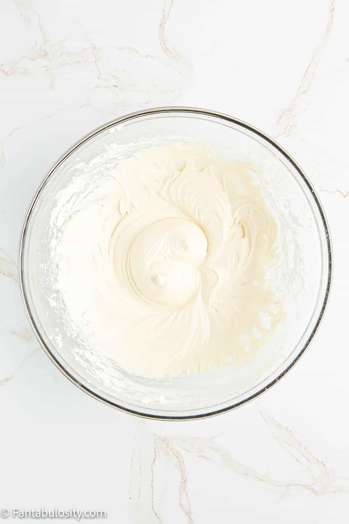 Mixed cream cheese mixture in glass bowl