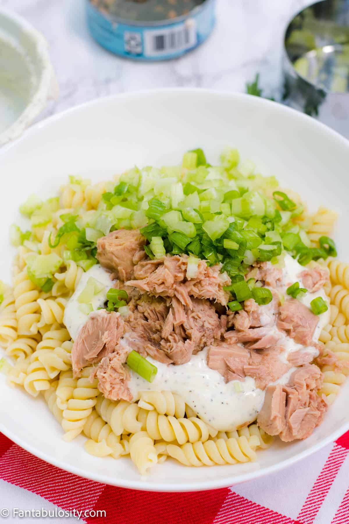 celery and green onion added to tuna pasta