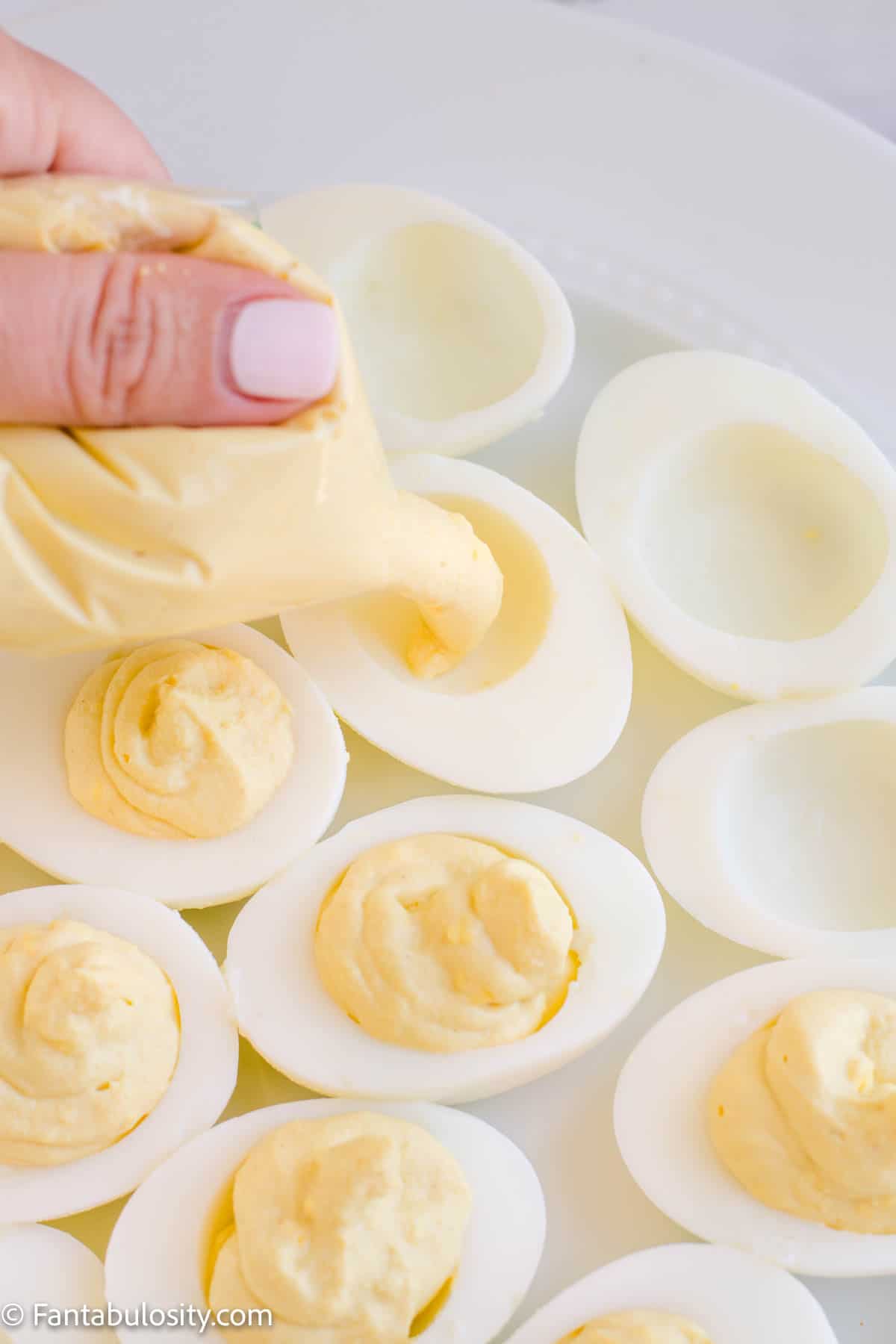Pouring yolk in egg whites