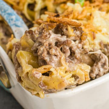 french onion beef casserole scooped up out of white dish