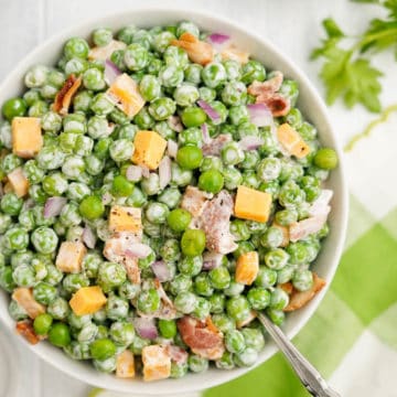 Close up image of old fashioned pea salad in a bowl.