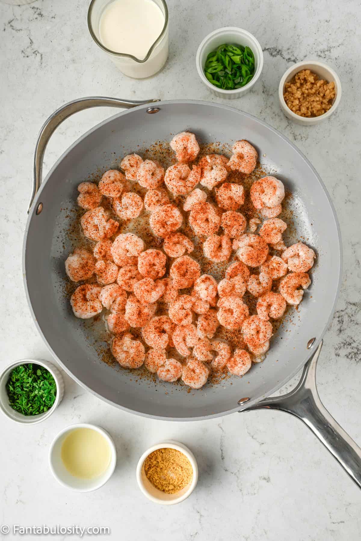 Seasoned shrimp in pan