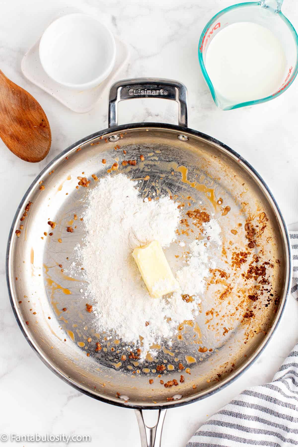 A skillet with butter and flour in it.