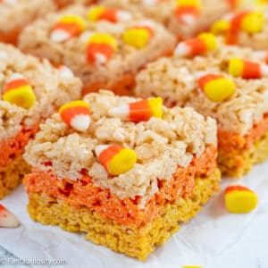 Close up photo of layered Candy corn rice krispie treats topped with candy corn