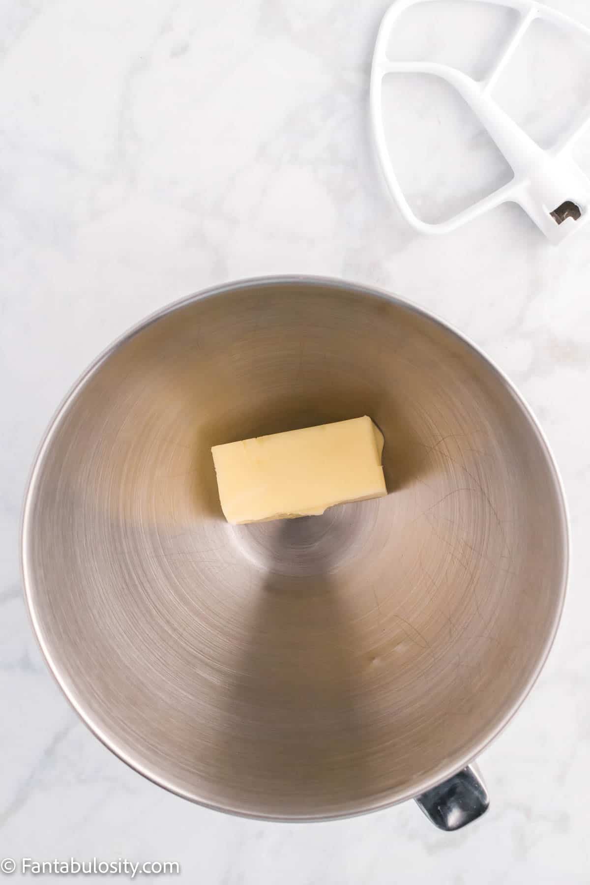 Butter in the bowl of a stand mixer. 