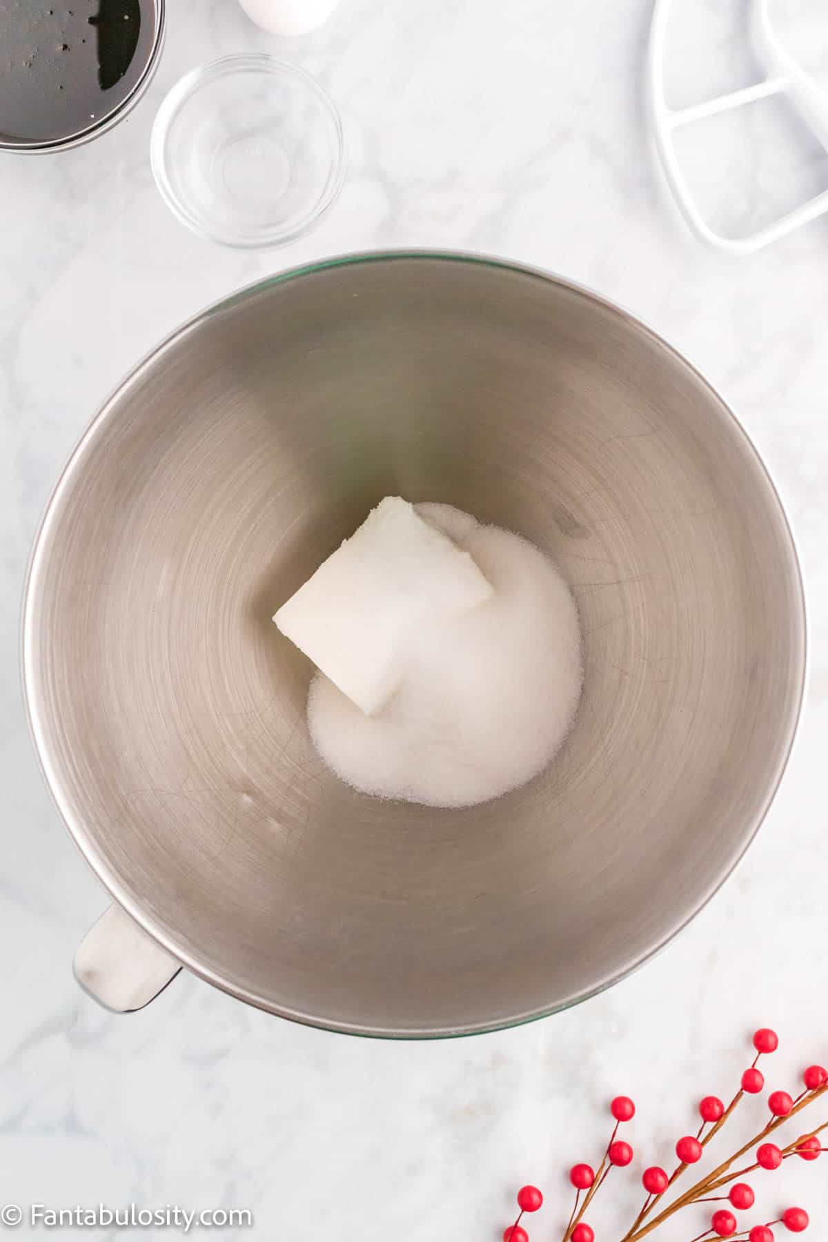 Sugar and shortening and shown in a metal mixing bowl