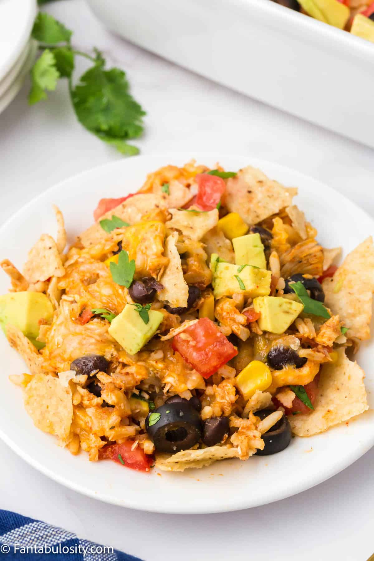 Chicken taco casserole serving on white plate