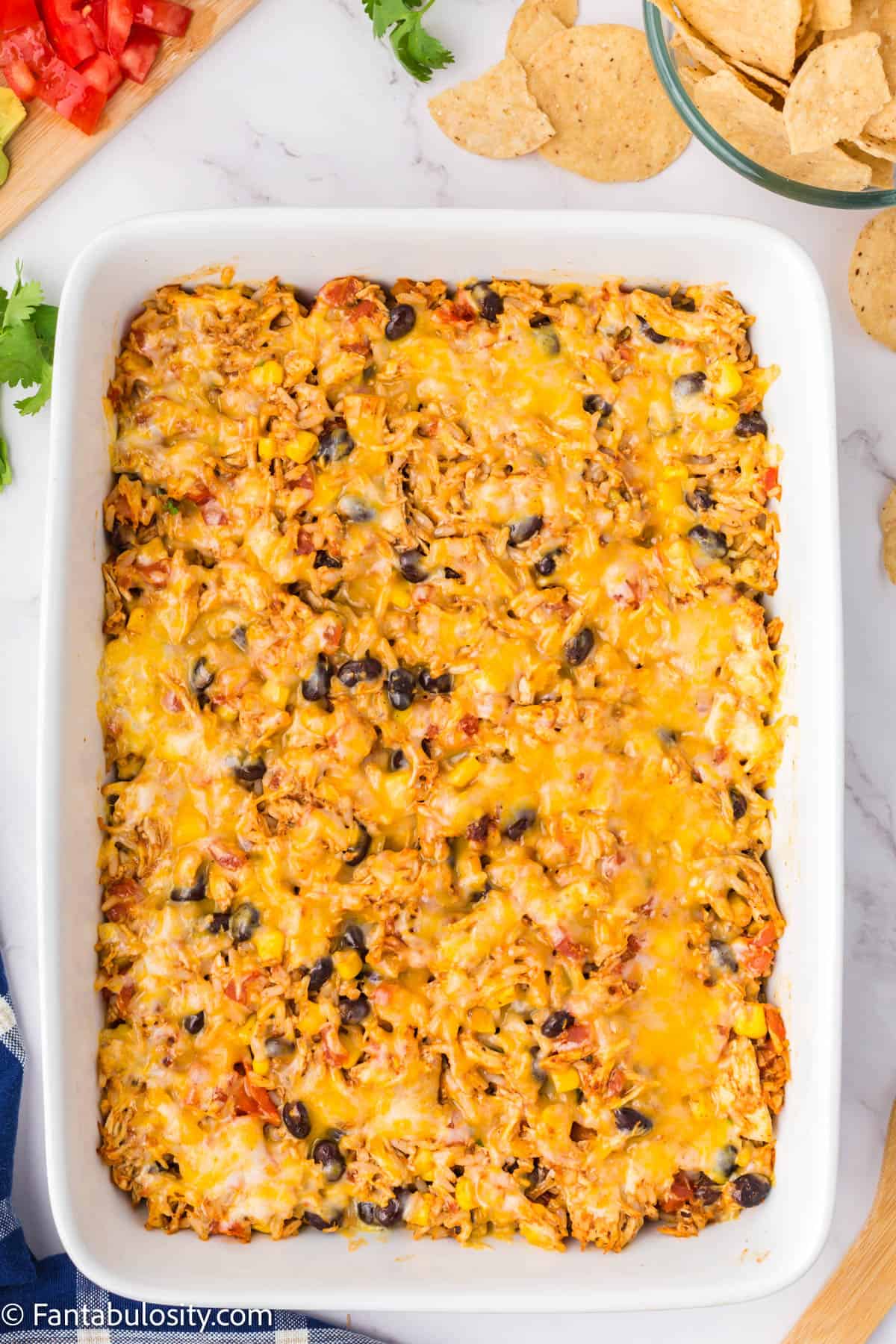 The baked casserole with the cheese on top looking melted.