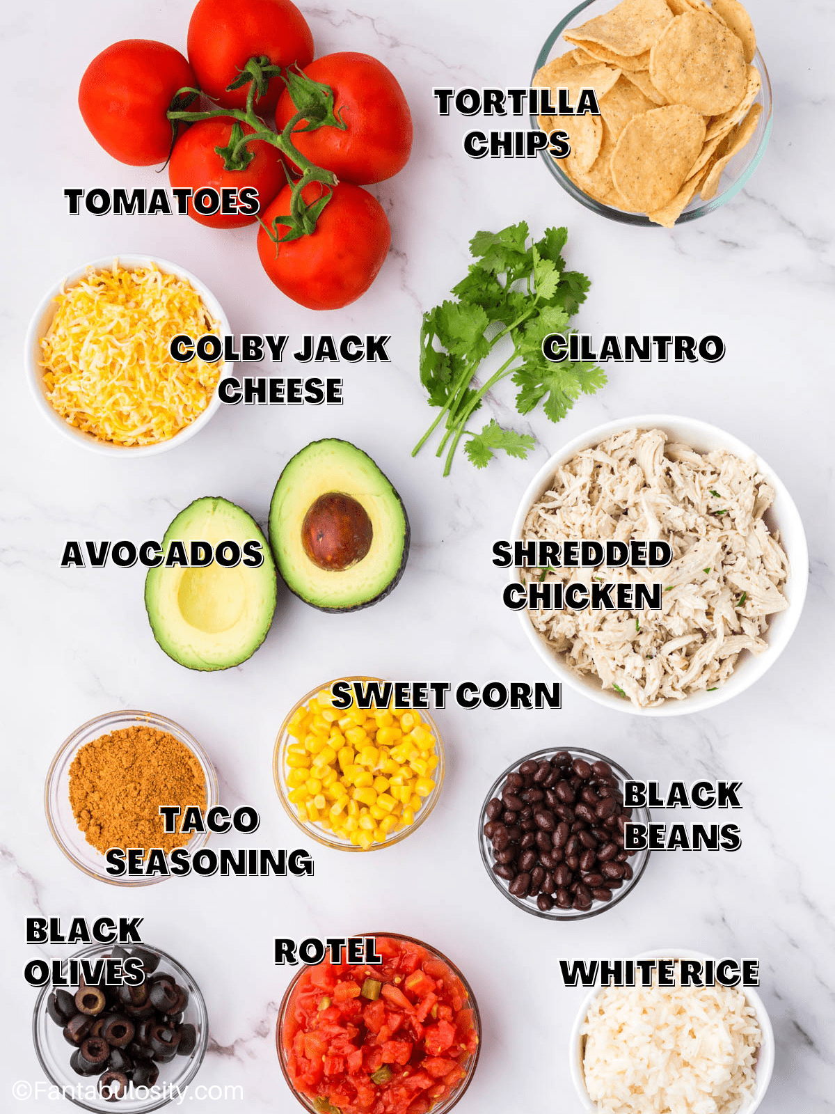 The ingredients for taco chicken casserole on a counter with labels on the image. 