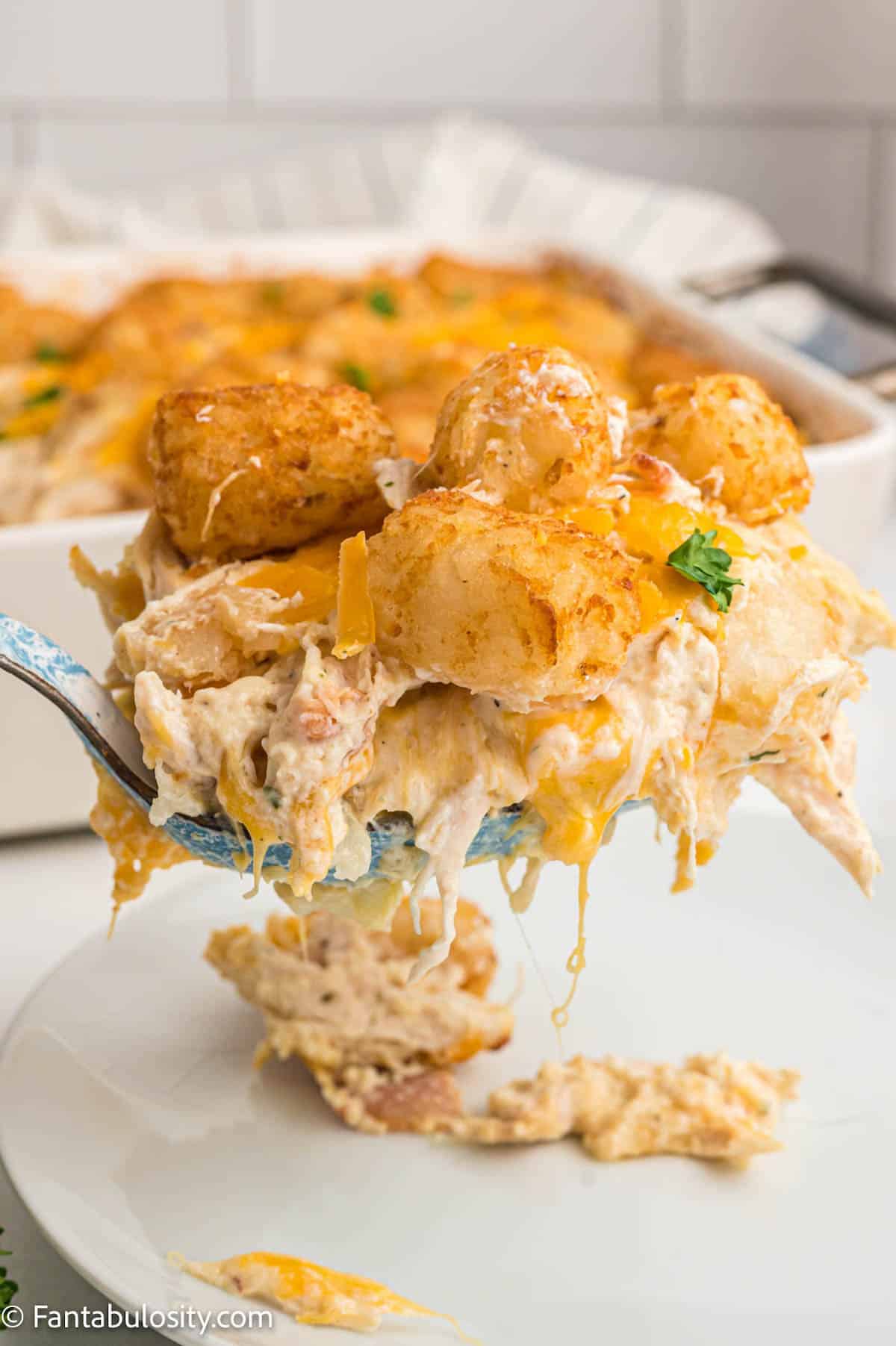 chicken tater tot casserole serving on spoon