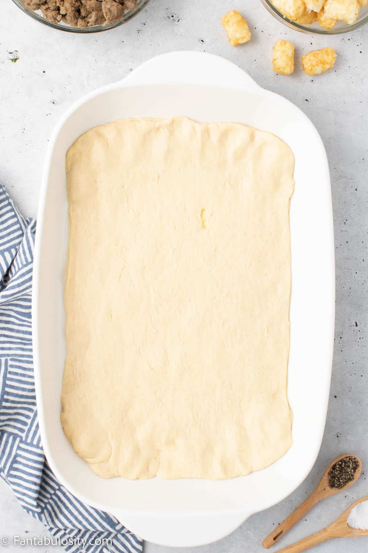 crescent rolls spread in to baking dish