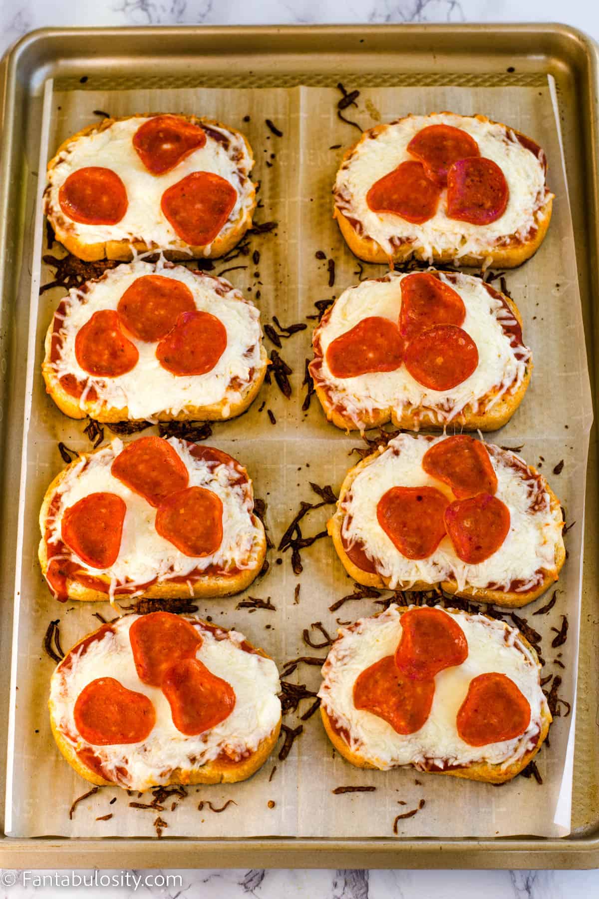 baked texas toast pizza on baking sheet