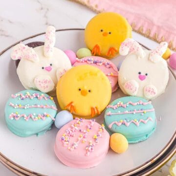 Easter Oreos - chicks, bunny, Easter eggs, on white plates.