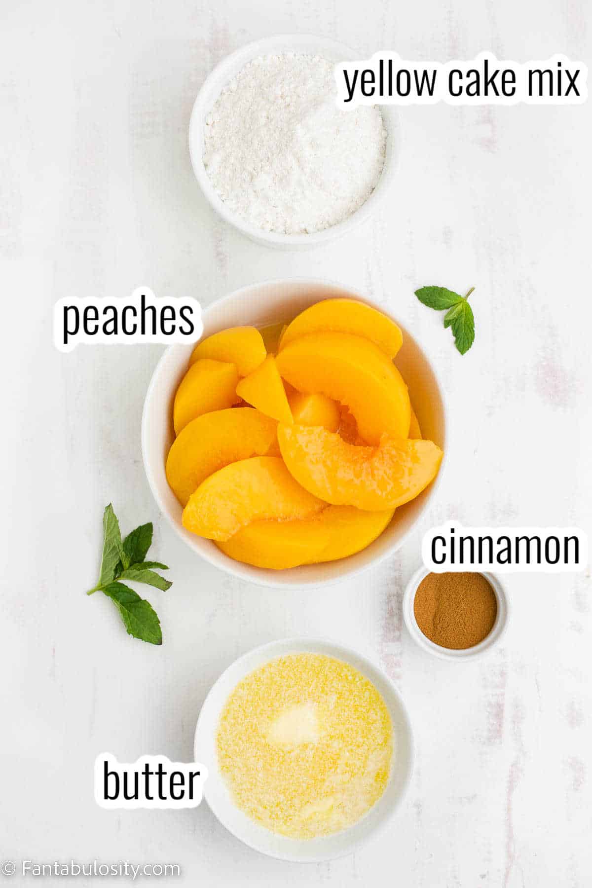 Ingredients for peach cobbler with cake mix.