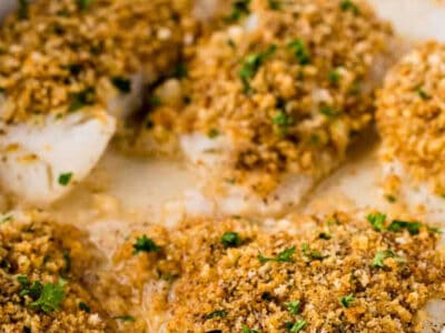 Baked panko cod in baking dish, with text on image too.