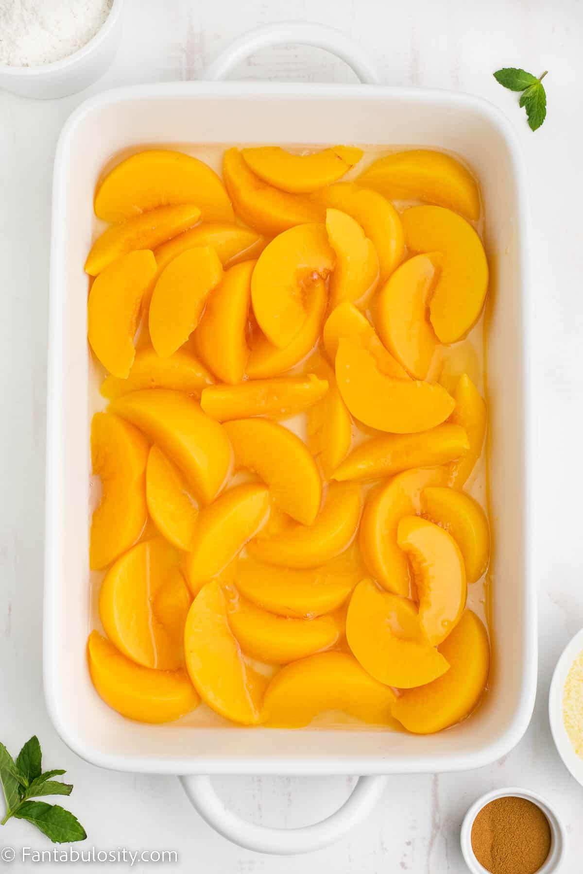 Peaches in bottom of cake pan.