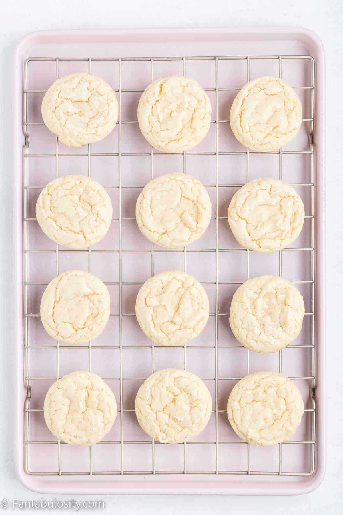 Baked cake mix cookies, cooling on cooling rack.