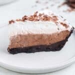 Slice of no bake chocolate pie on white plate.