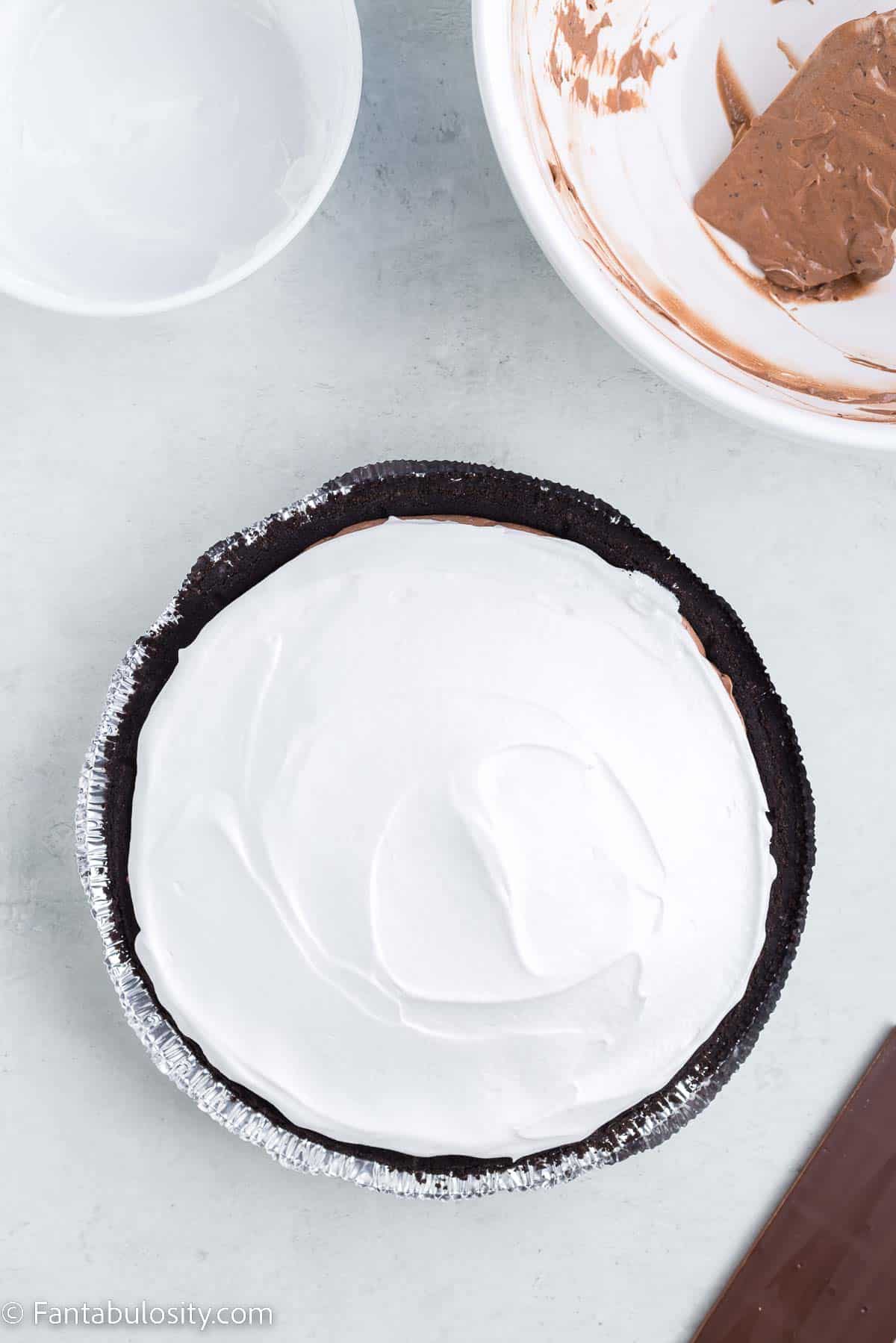 Cool Whip topping on top of chocolate pie.