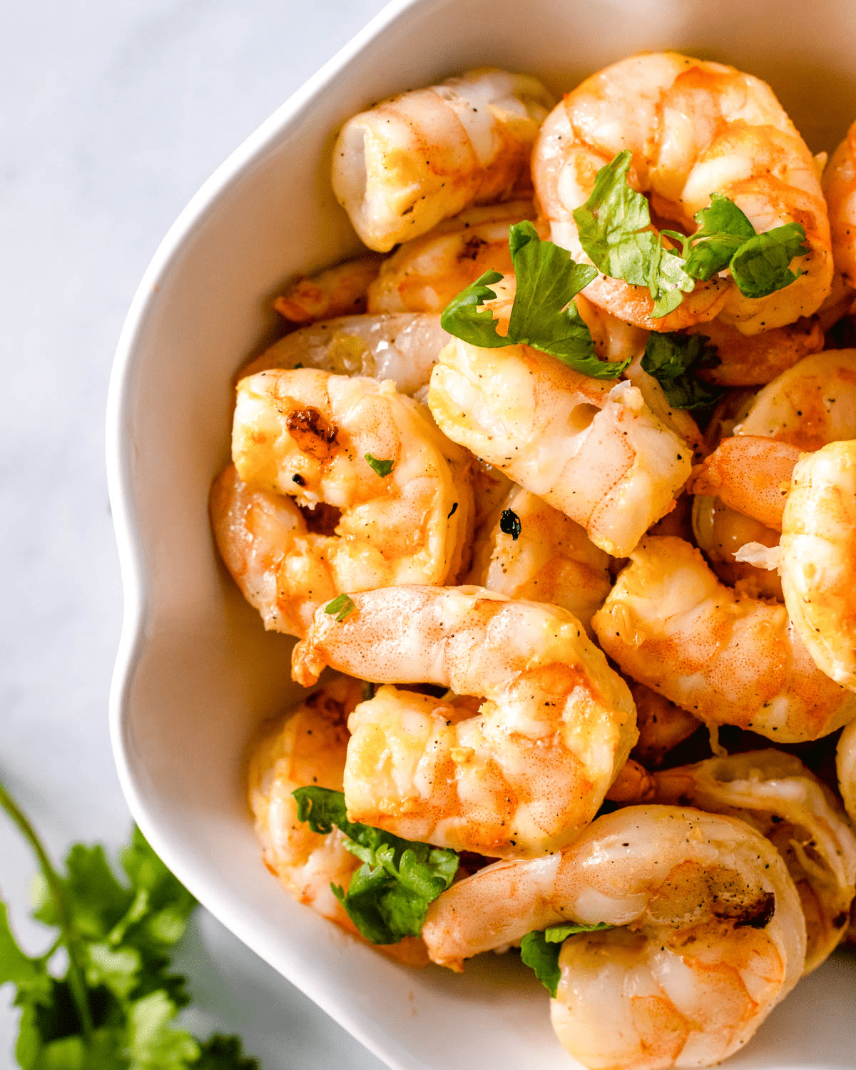 Marinated shrimp in a white bowl